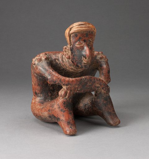 Seated Male Figure Leaning Forward with Arms Crossed over Knees