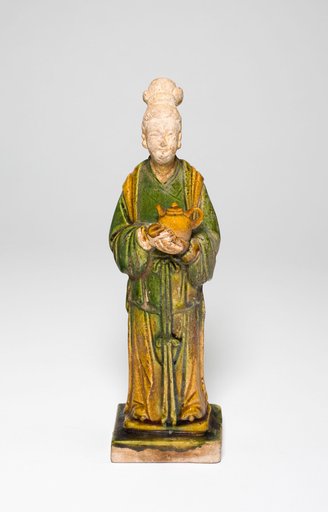 Attendant Holding a Teapot