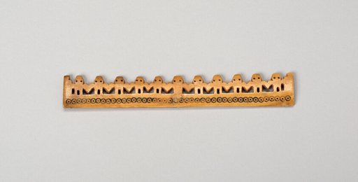 Balance-Beam Scale with Row of Cut-Out Figures and Incised Circles