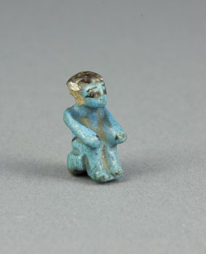 Figurine of a Seated Man