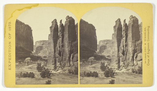 Camp Beauty, Canñon de Chelle; walls 1.200 feet high, width of Cañon at this point about one fourth of a mile. This view shows the perpendicular effect wrought by the action of floods. The Artist of the Expedition, Mr. Wyant, of New York, made a study of this scene with the intention to paint it as a characteristic Canon view, No. 25 from the series "Geographical Explorations and Surveys West of the 100th Meridian"