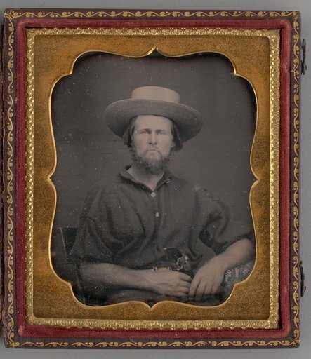 Untitled (Portrait of a Man Wearing a Straw Hat)
