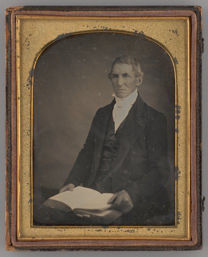 Untitled (Portrait of a Seated Man Holding a Book)