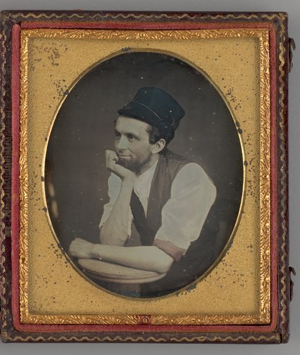 Untitled (Portrait of Seated Man Wearing a Hat)