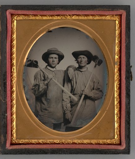 Untitled (Portrait of Two Men Holding Shovels)