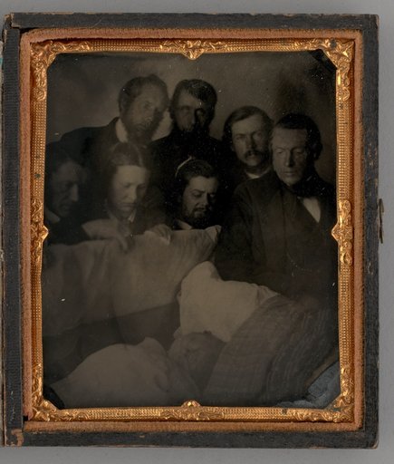 Untitled (People Standing Around a Open Casket)