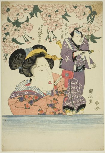 Woman holding puppet of actor Onoe Kikugoro III as Gokuin Sen'emon