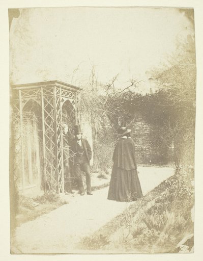 Unidentified Woman and Two Men Standing Outdoors