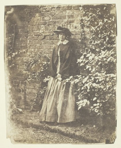 Mrs. Craik Leaning Against Wall and Bushes