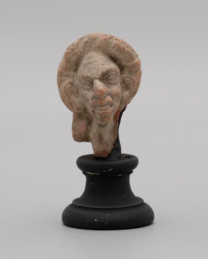 Head of a Grotesque Wearing Wreath