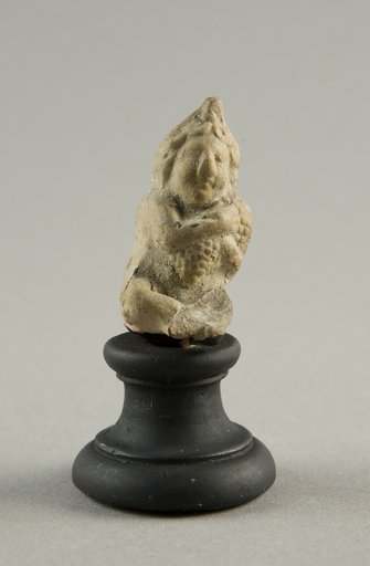Figurine of a Child Clutching Grapes