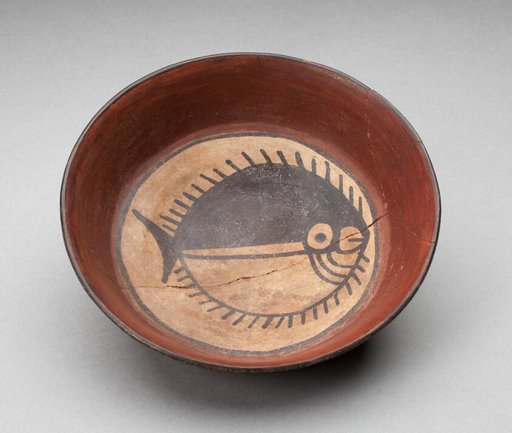 Plate Depicting Round Black-and-White Fish in Interior