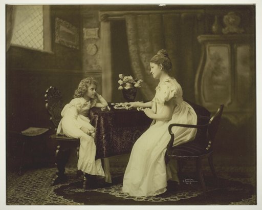 Woman and Child Playing Dominoes at Table