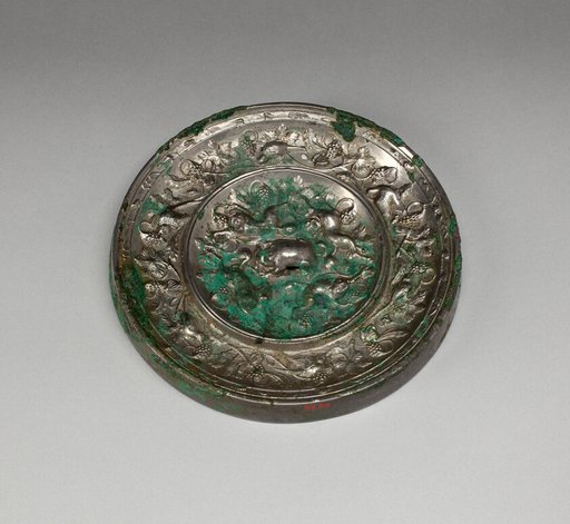 Mirror with Images of Purity and Immortality and “Lion and Grapevine” Design