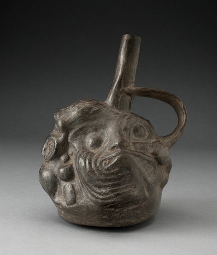 Blackware Spouted Vessel in the Form of a Composite Face, Animals, and Fish
