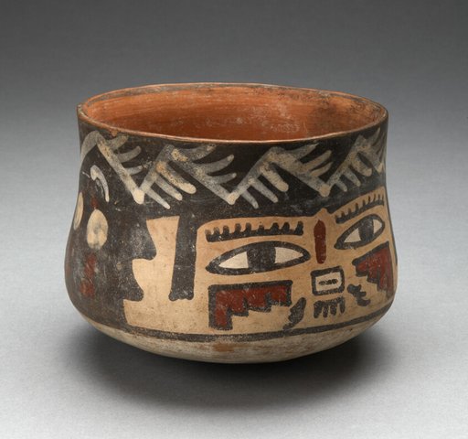 Short Beaker Depicting Human Head