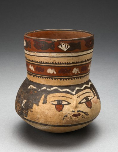 Beaker Depicting Human Head and Rows of Geometric Motifs