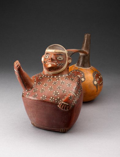 Double-Chambered Vessel Depicting a Figure and Trophy Heads