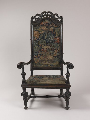 wooden chair with needlepoint upholstery