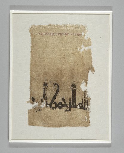 Fragment of a garment with tapestry inscription