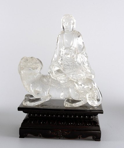 Buddha Seated on Foo Dog
