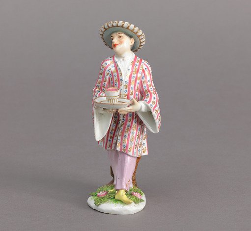 Figure of a Chinese Man or Servant Holding a Cup and Saucer