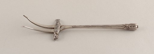 Small Serving Fork with Tines Skewering Fish