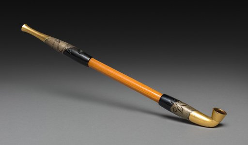 Tobacco Pipe with Maple Leaves in a River