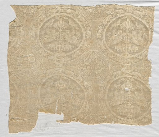 Fragment with confronted animal medallions and kufic bands
