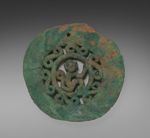 Medallion, beads, and spindle whorls