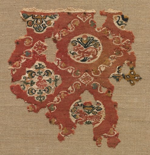Tapestry with lattice of animals in medallions
