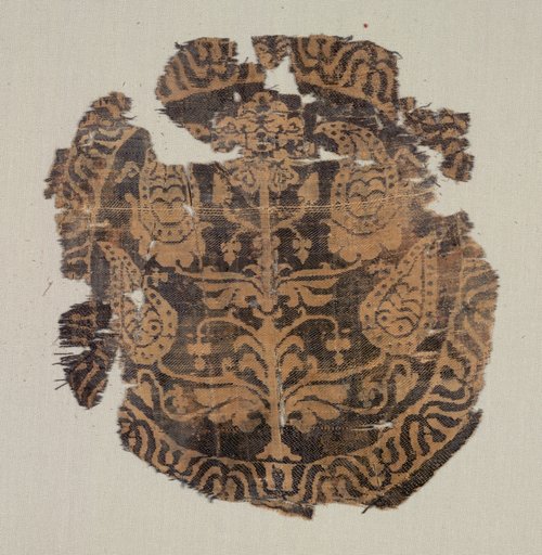 Roundel with curvilinear palmette tree, from a tunic