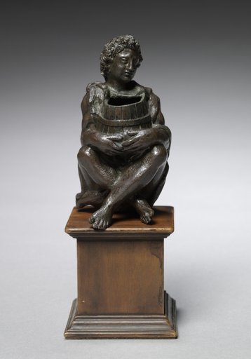 Seated Boy Clothed with Goat Skins Holding an Open Barrel