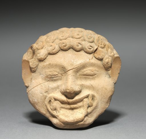 Gorgoneion Plaque with Incised Figure of a Dancing Satyr