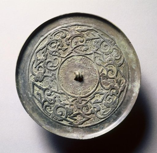 Mirror with Serpentine Interlaces and Angular Meanders