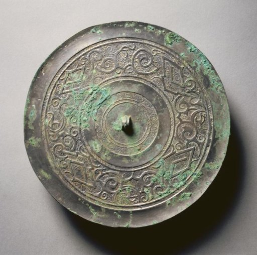 Mirror with Serpentine Interlaces and Angular Meanders