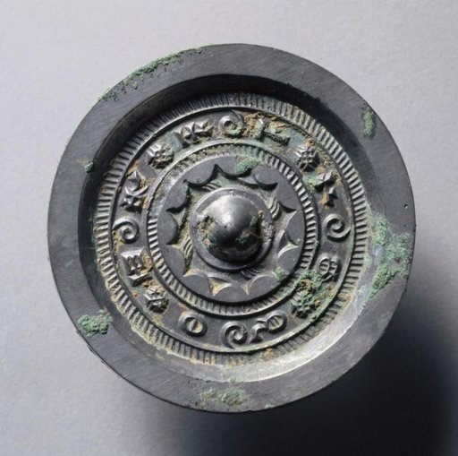 Mirror with Concentric Circles and Linked Arcs
