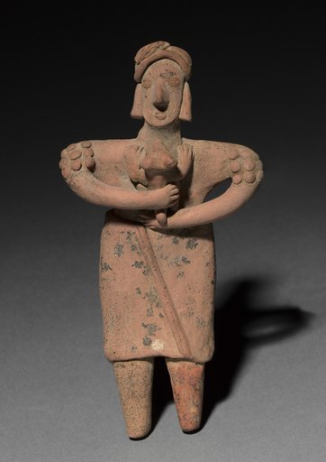 Standing figurine holding an animal (dog?)