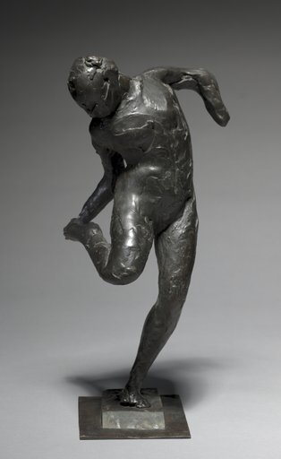 Dancer Looking at the Sole of her Right Foot