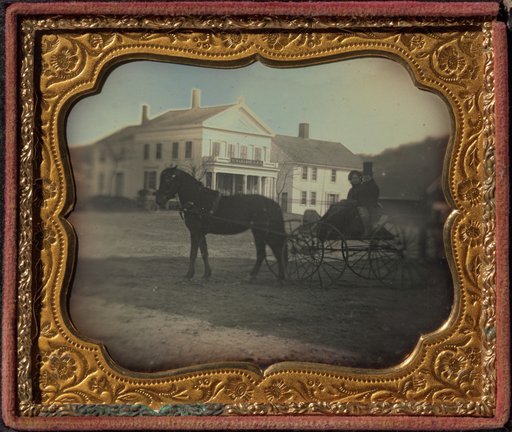 Solomon Clark Spelman and Martha W. Spelman in front of S.C. Spelman General Store, Hampden, MA