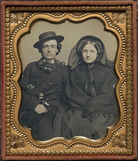Seated couple in mourning attire