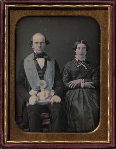 Seated Masonic lodge master and wife