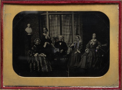 English family of five with marble bust