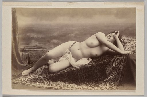 Untitled (reclining nude on carpet against painted backdrop of waves)