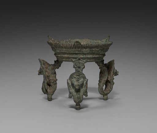 Tripod stand with nagas for a ritual conch shell