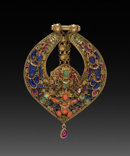Deity Earring with Vishnu on Garuda (front) and chepu (monster mask) (back)