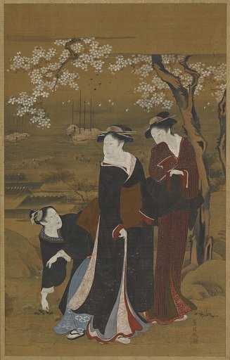 Three women under a flowering cherry tree at the seashore