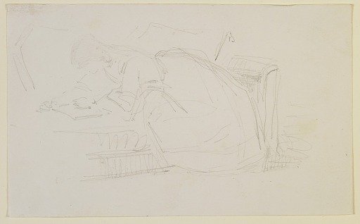 A girl reclining on a couch, reading