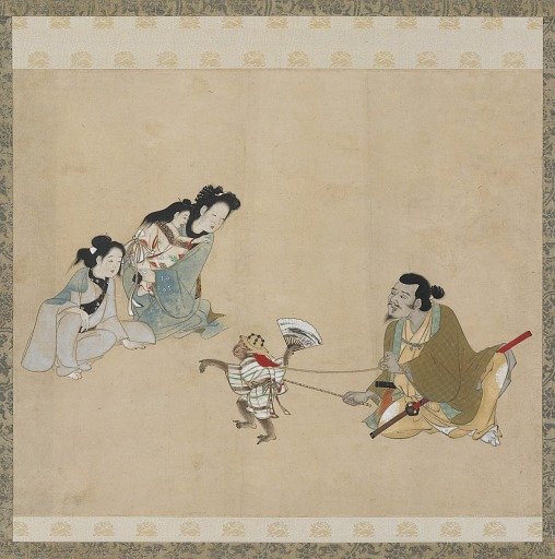 Monkey trainer and monkey performing a dance