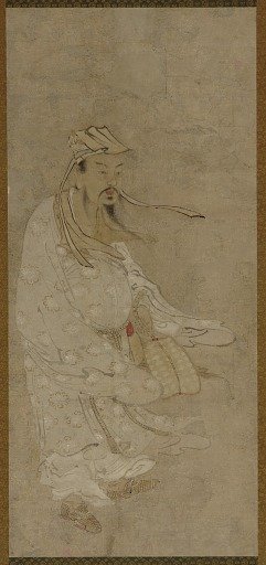 A Chinese man standing in a high wind